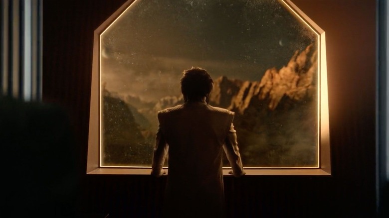 Ethan Peck as Sybok leaning against a window in Star Trek: Strange New Worlds