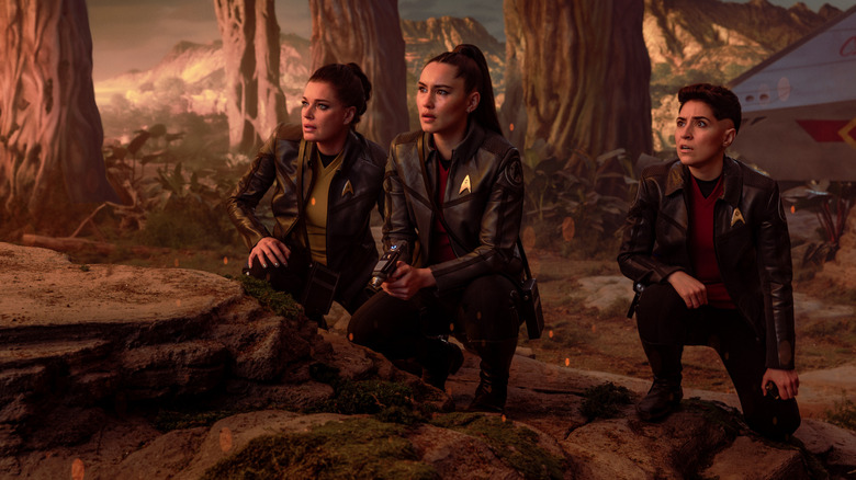Rebecca Romijn as Una, Christina Chong as La'an Noonien-Singh, and Melissa Navia as Erica Ortegas in season 4, episode 1, of Star Trek: Strange New Worlds streaming on Paramount+, 2026