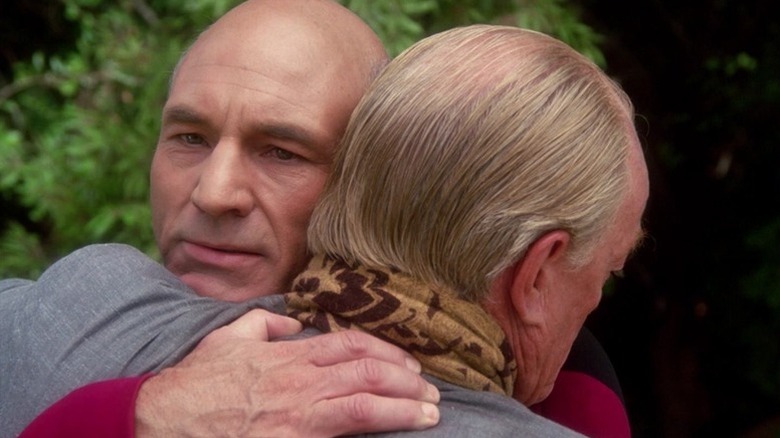 Jean-Luc Picard (Patrick Stewart) hugs Robert Picard (Jeremy Kemp) in Star Trek: The Next Generation