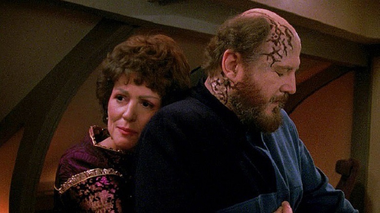 Lxwana Troi and Doctor Timicin embracing