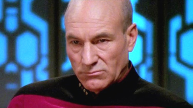 Picard smirks at the camera