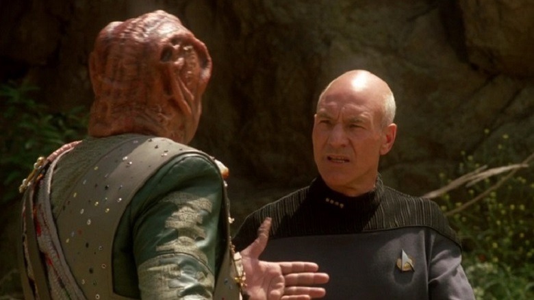 Picard and Dathon, conversing