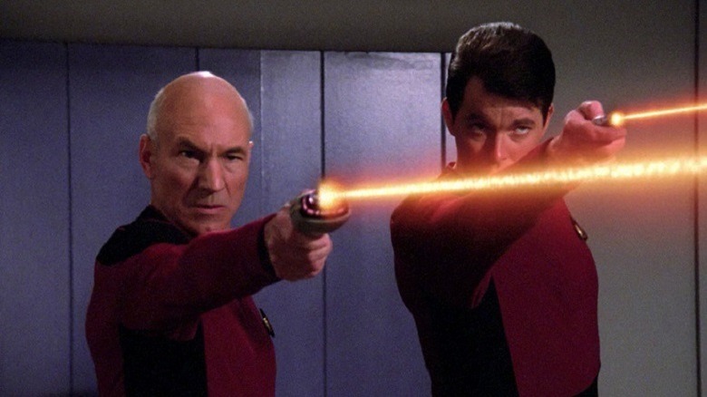 Picard and Riker fire their phasers