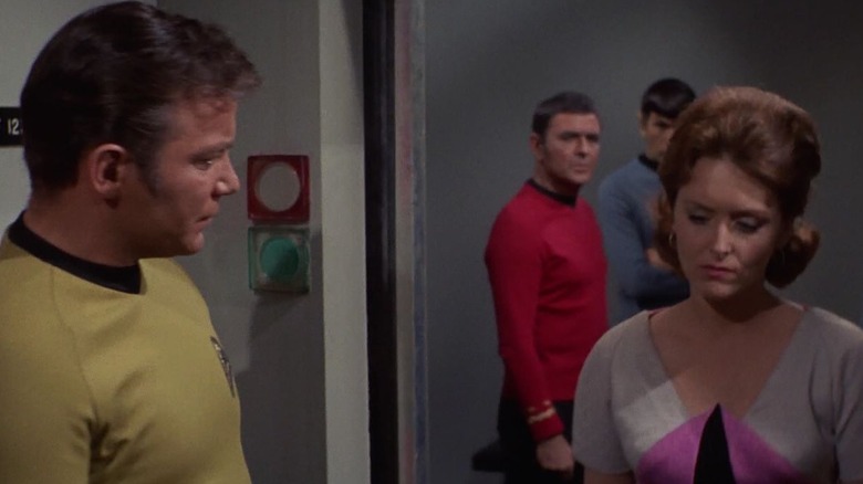 Dr. Lester in the body of Captain Kirk, holding a phaser on Captain Kirk, in the body of Janice Lester. From Star Trek.