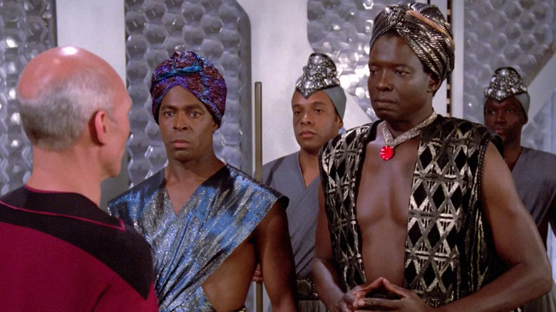 Patrick Stewart as Captain Jean-Luc Picard and Jessie Lawrence Ferguson as Lutan in Star Trek: The Next Generation