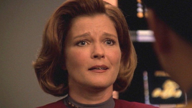Captain Janeway in a conference room on Star Trek: Voyager