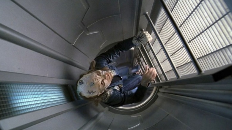 Bonita Friedericy as Rooney climbs a ladder in Star Trek: Enterprise