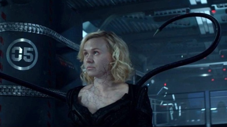 Alison Pill as Dr. Agnes Jurati sits in her Borg outfit while tentacles rise in the air in Star Trek: Picard