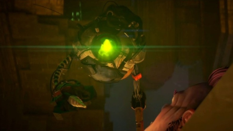 Zero looks ahead while shining a green light as Jankom Pog looks up in Star Trek: Prodigy