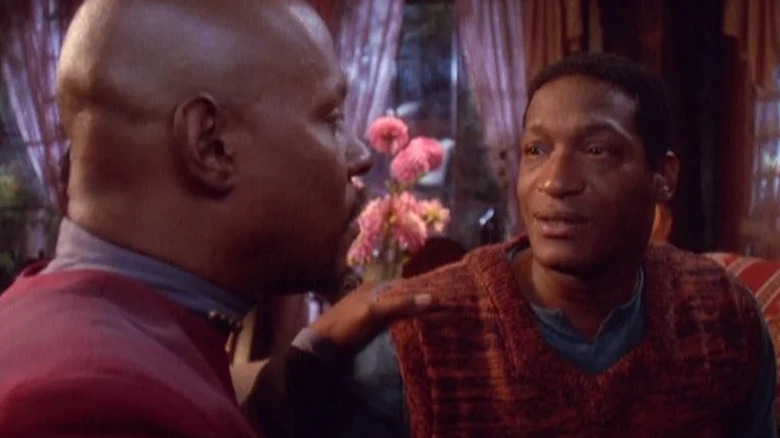 Benjamin Sisko (Avery Brooks) puts his hand on the shoulder of an adult Jake Sisko (Tony Todd) in Star Trek: Deep Space Nine