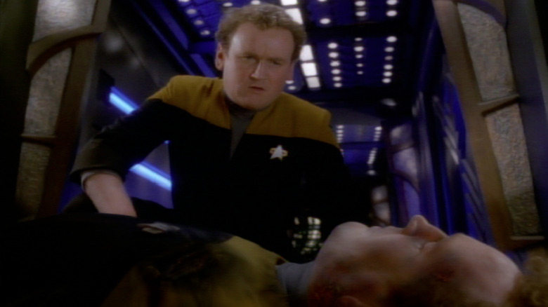 Miles O'Brien (Colm Meaney) examines his own body in Star Trek: Deep Space Nine