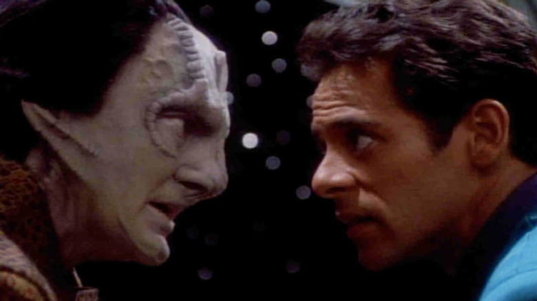 Garak and Dr. Bashir leaning in close on Star Trek: Deep Space Nine