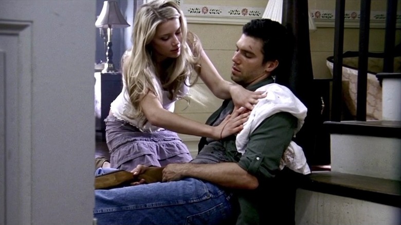 Amber Heard as Mandy Lane tends to Anson Mount as Garth in All the Boys Love Mandy Lane