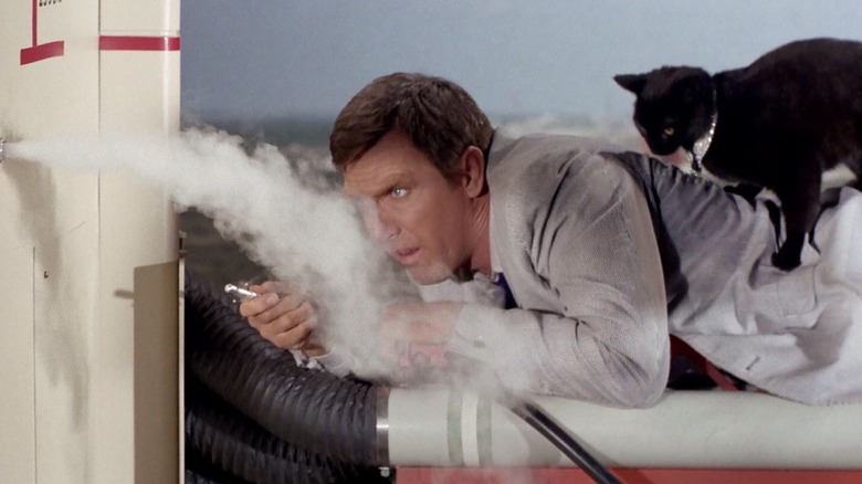Gary Seven perched on a high scaffold in Star Trek