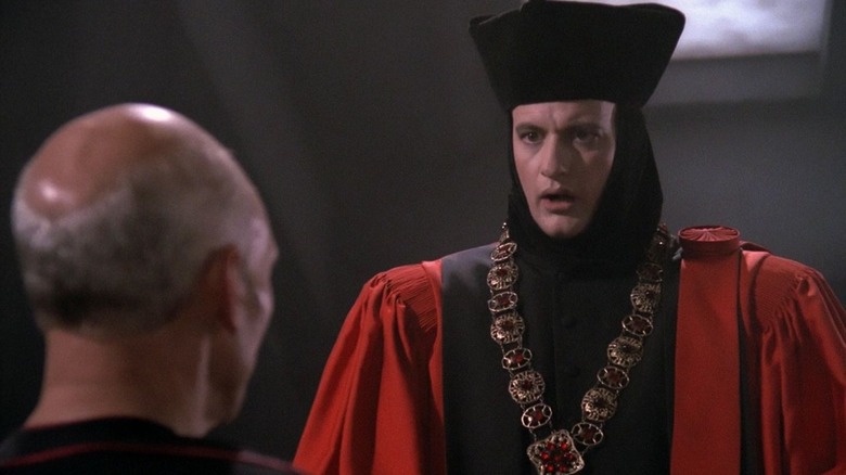 S, dressed as a future judge, talks to Captain Picard in Star Trek: The Next Generation