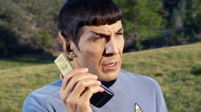 Leonard Nimoy's Spock speaks on a communicator in Star Trek