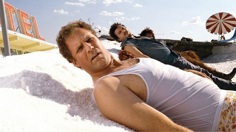 Will Ferrell as Dr. Rick Marshall, Danny McBride as Will Stanton and Jorma Taccone as Chaka are flat on their backs at a salt flat in Land of the Lost