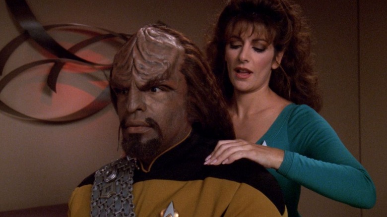 Troi giving Worf a shoulder massage on Star Trek: The Next Generation