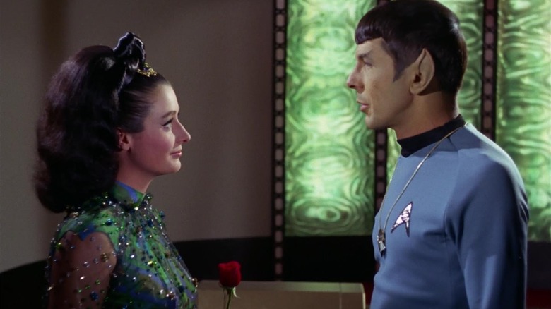 Spok and Dr. Miranda Jones face each other in the Star Trek transport room