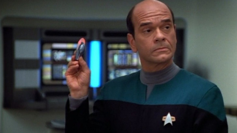 The Doctor holding a widget on Star Trek: Voyager