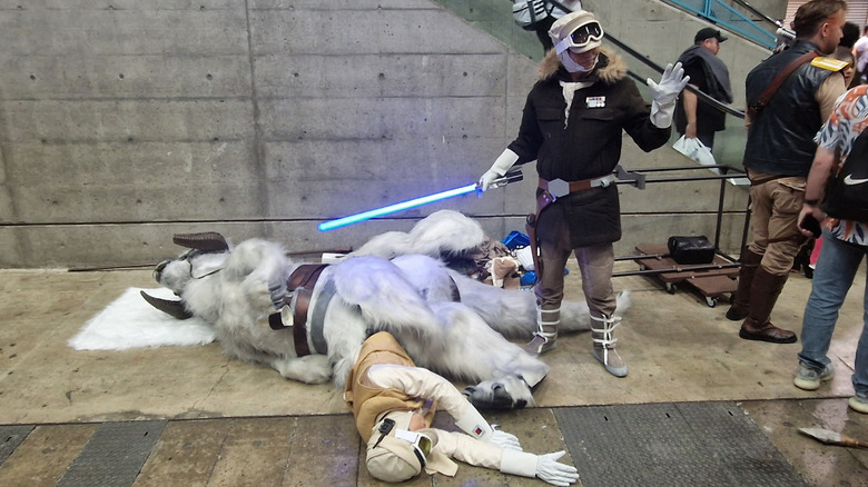 A cosplayer dressed as Han next to Luke and a Tauntaun at Star Wars Celebration