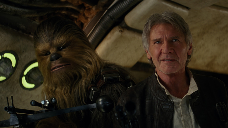 Han and Chewie smile as they board the Millennium Falcon in Star Wars Episode VII: The Force Awakens