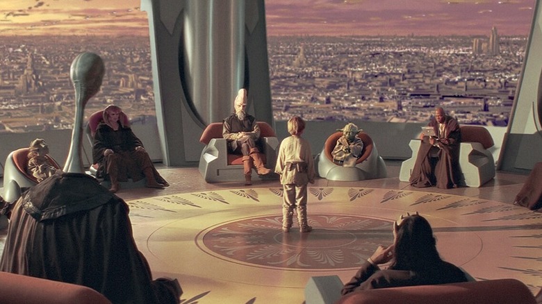 Anakin Skywalker (Jake Lloyd) stands in the middle of the High Jedi Council in Star Wars: Episode I - The Phantom Menace