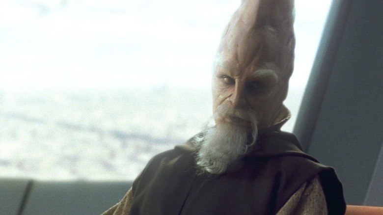 Ki-Adi-Mundi (Silas Carson) glances over while seated in Star Wars: Episode I - The Phantom Menace