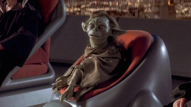 Yaddle sits in a chair in Star Wars: Episode I - The Phantom Menace