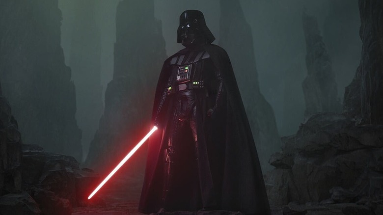Darth Vader standing with his red lightsaber ignited in Obi-Wan Kenobi