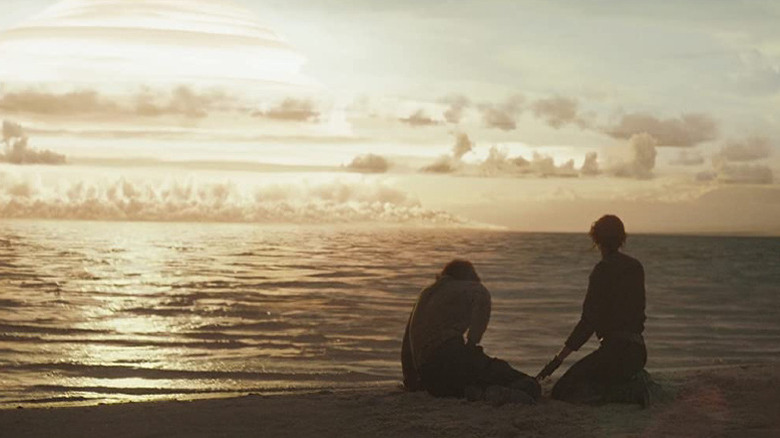 Cassian Andor and Jyn Erso find refuge on a Scarif beach in "Rogue One"