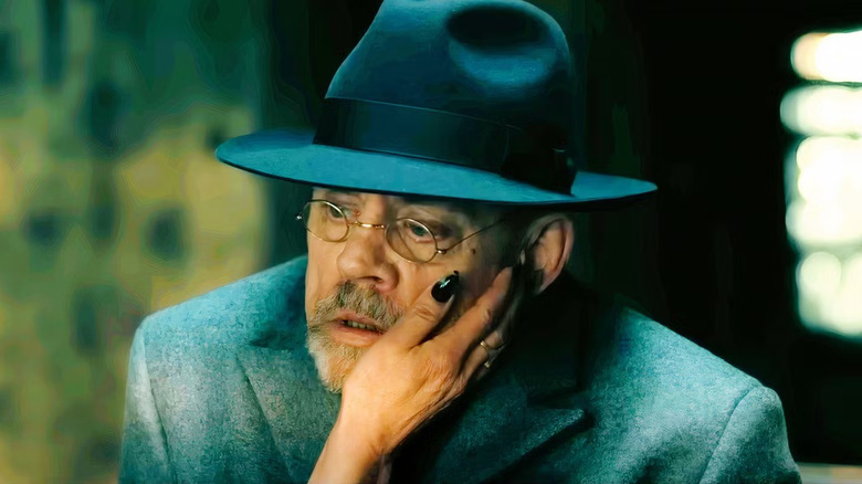 Arthur Pym with a mysterious woman's hand on his face in The Fall of the House of Usher