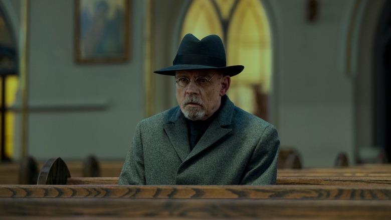 Pym sitting in a church pew in The Fall of the House of Usher