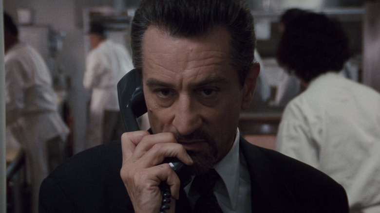 Robert De Niro as Neil McCauley on the phone in the kitchen in Heat