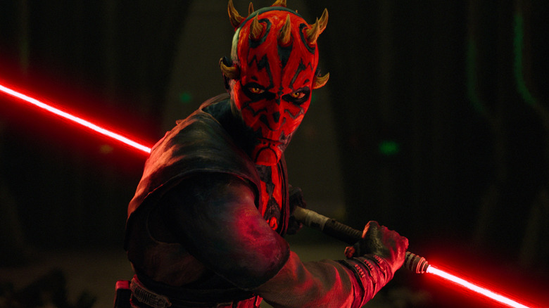 Maaul holding his double-bladed lightsaber behind his back in Star Wars: Maul - Shadow Lord