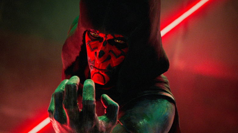 Sam Witwer as the voice of Darth Maul brandishing his lightsaber and using the force in Star Wars: Maul - Shadow Lord