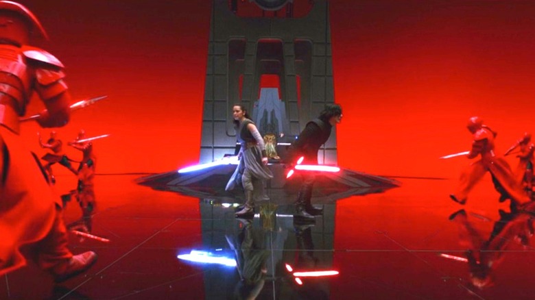 Rey and Kylo Ren in red throne room