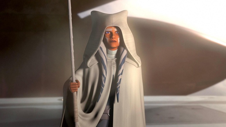 Ahsoka Tano holding her staff in her white robe in the Star Wars Rebels series finale