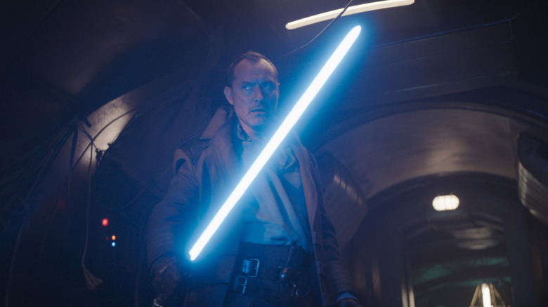 Jod ignites a lightsaber in Skeleton Crew