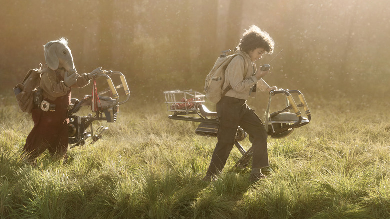 Neel and Wim pushing their bikes in Star Wars: Skeleton Crew