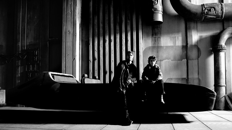 Ryan Gosling and Flynn Gray in character leaning against a speeder vehicle on the set of Star Wars: Starfighter