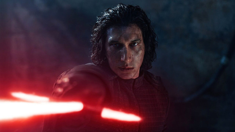 Kylo Ren points his lightsaber in Star Wars: The Rise of Skywalker