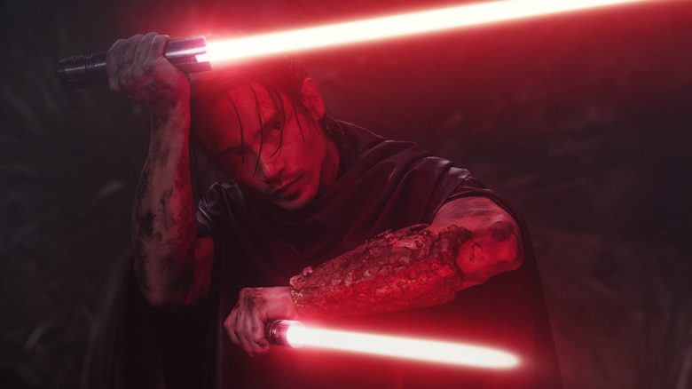 Qimir holds his lightsabers in The Acolyte