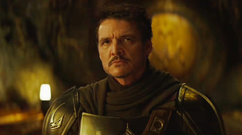 Pedro Pascal as Din Djarin glaring defiantly in The Mandalorian and Grogu