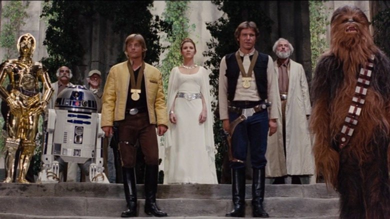 Anthony Daniels, Kenny Baker, Mark Hamill, Carrie Fisher, Harrison Ford, and Peter Mayhew in Star Wars: A New Hope