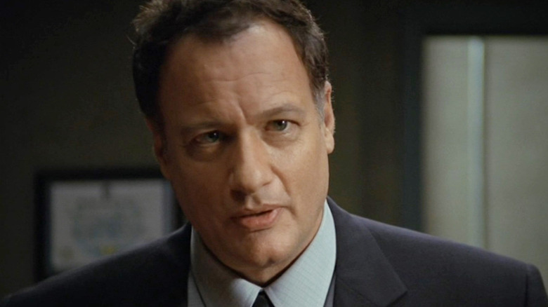 John de Lancie as Colonel Frank Simmons in a suit in the Stargate SG-1 Episode The Fifth Man