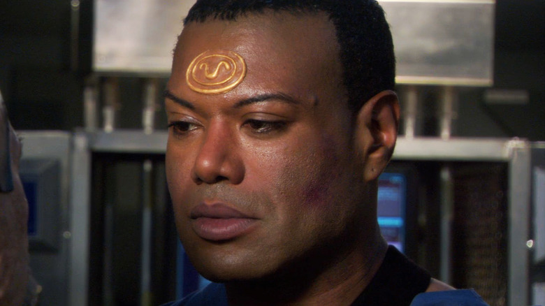 Christopher Judge's Teal'c looks across frame in Stargate SG-1