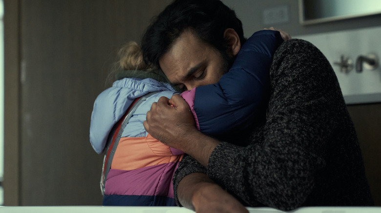Himesh Patel as Jeevan hugs Matilda Lawler as young Kirsten in Station Eleven