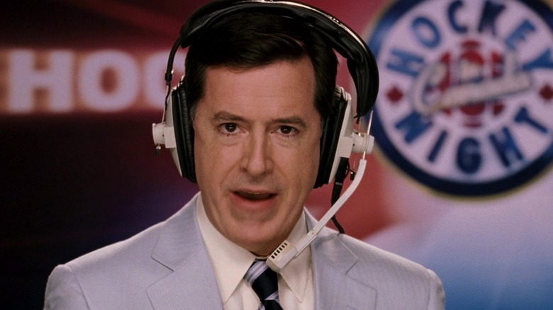 Jay Kell in his announcers headset looking at the camera in The Love Guru