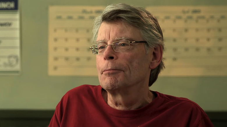 Stephen King sitting down in a featurette for 11.22.63
